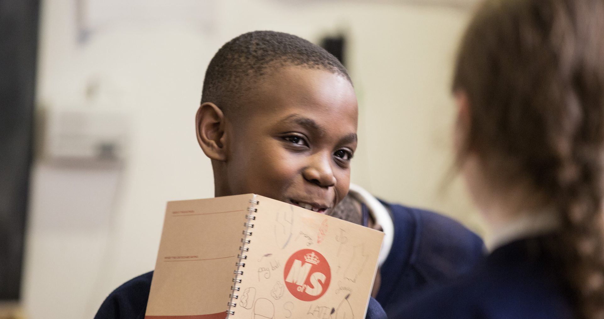 Boy with Ministry notebook