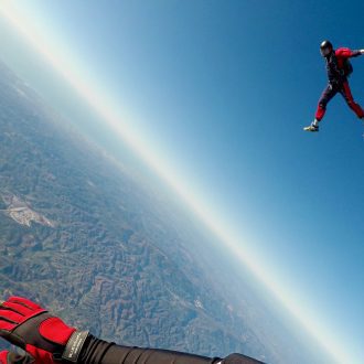 Man jumps out of plane in a skydive