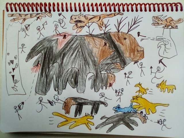 A child's picture of a large furry byson, with long antlers laying by a fire