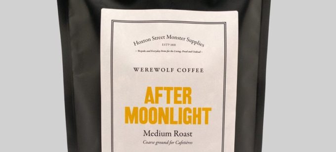 A black foil coffee bag with After Moonlight written in bold yellow letters across the front