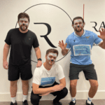 Three young men pose in monster face paint and running clothes.