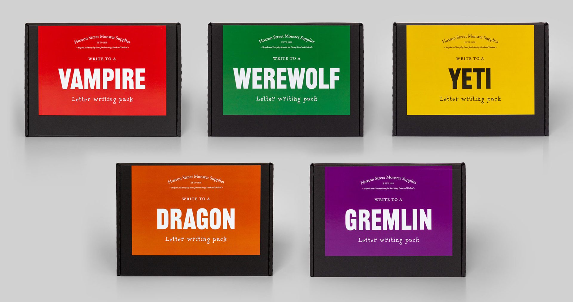 five colourful packs, the size of a letter, sit next to each other on a grey background.