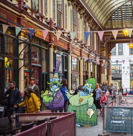 Image of two life-sized cartoon Zombies roaming around Victorian Leadenhall Market