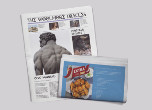 A newspaper is laid out over a grey table. The front cover shows a greek god. The other folded back of the newspaper shows an advert for 'Hades Lava Chicken'.