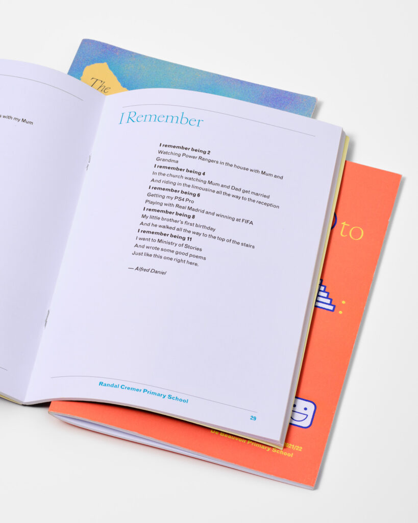 A pile of a5 sized anthologies, with bright coloured covers and interesting writing, lay open on a white background